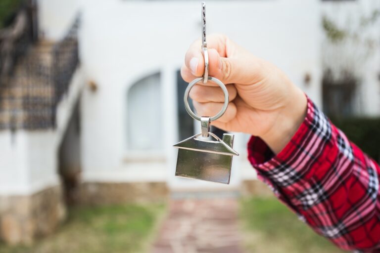 New home, house, property and tenant - Real estate agent handing a house key